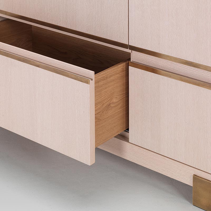 Modernist oak sideboard with drawer open showing solid oak interior and brass trim detail