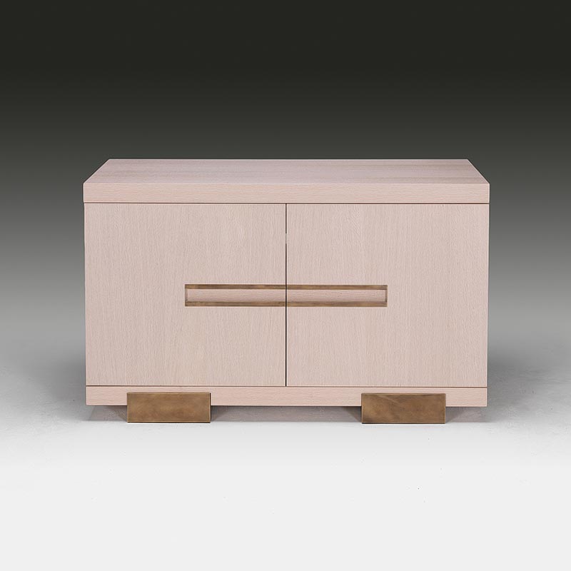 Modernist bleached oak sideboard front view of smaller unit with integrated brass handle detail